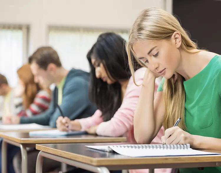 Picture of girl in class reading