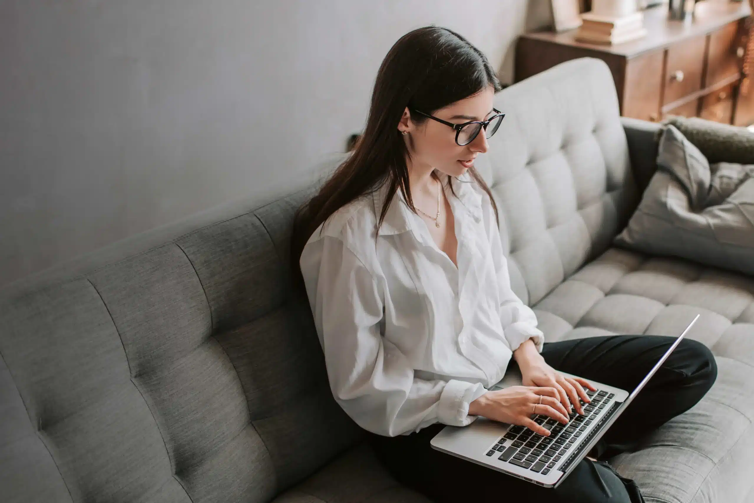 Woman on Couch with Laptop