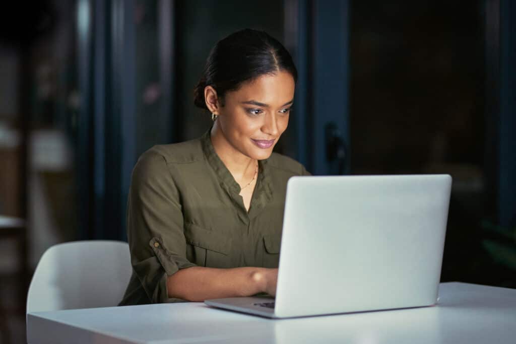 Peachtree Group woman working on laptop