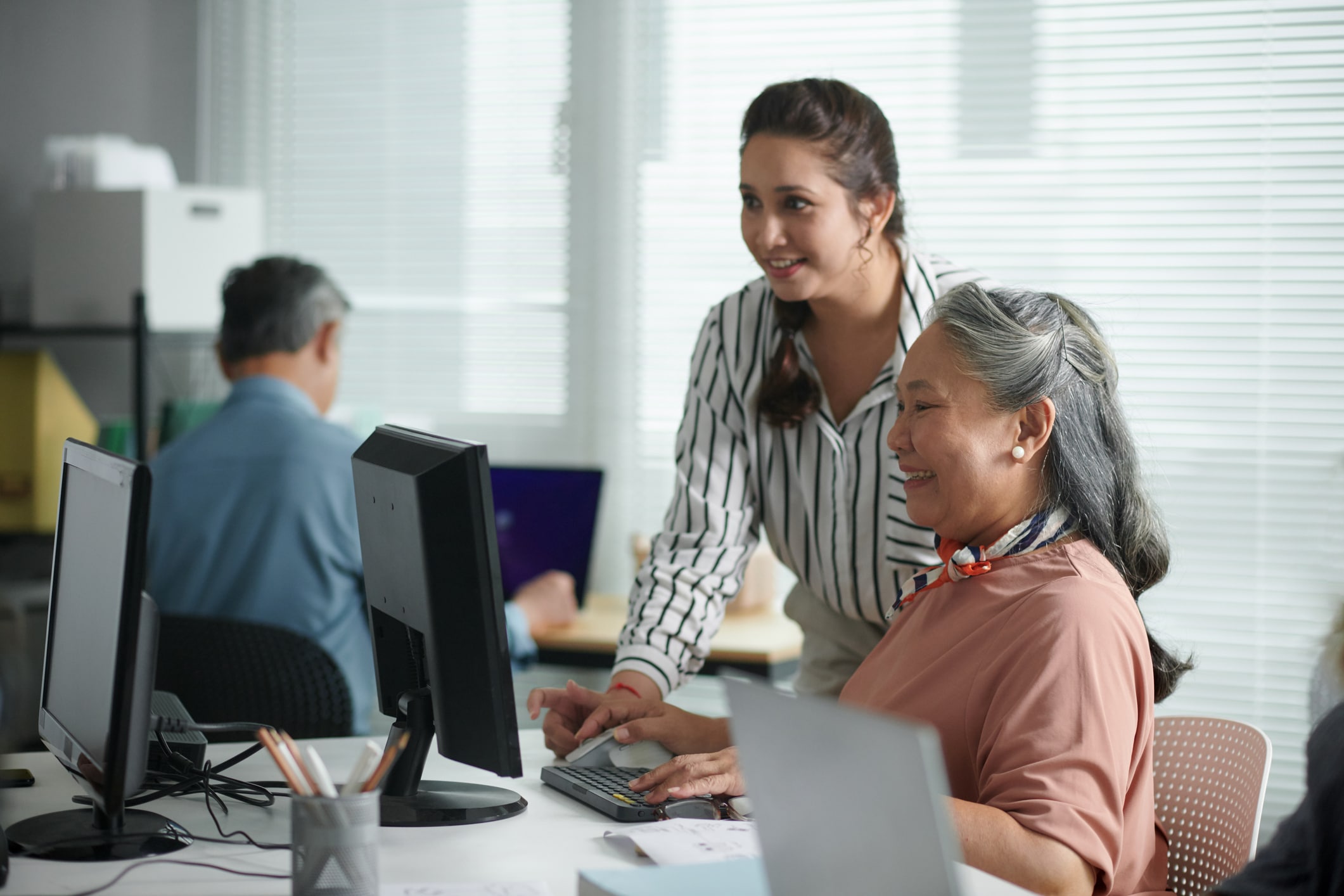 Colleagues looking at a computer together