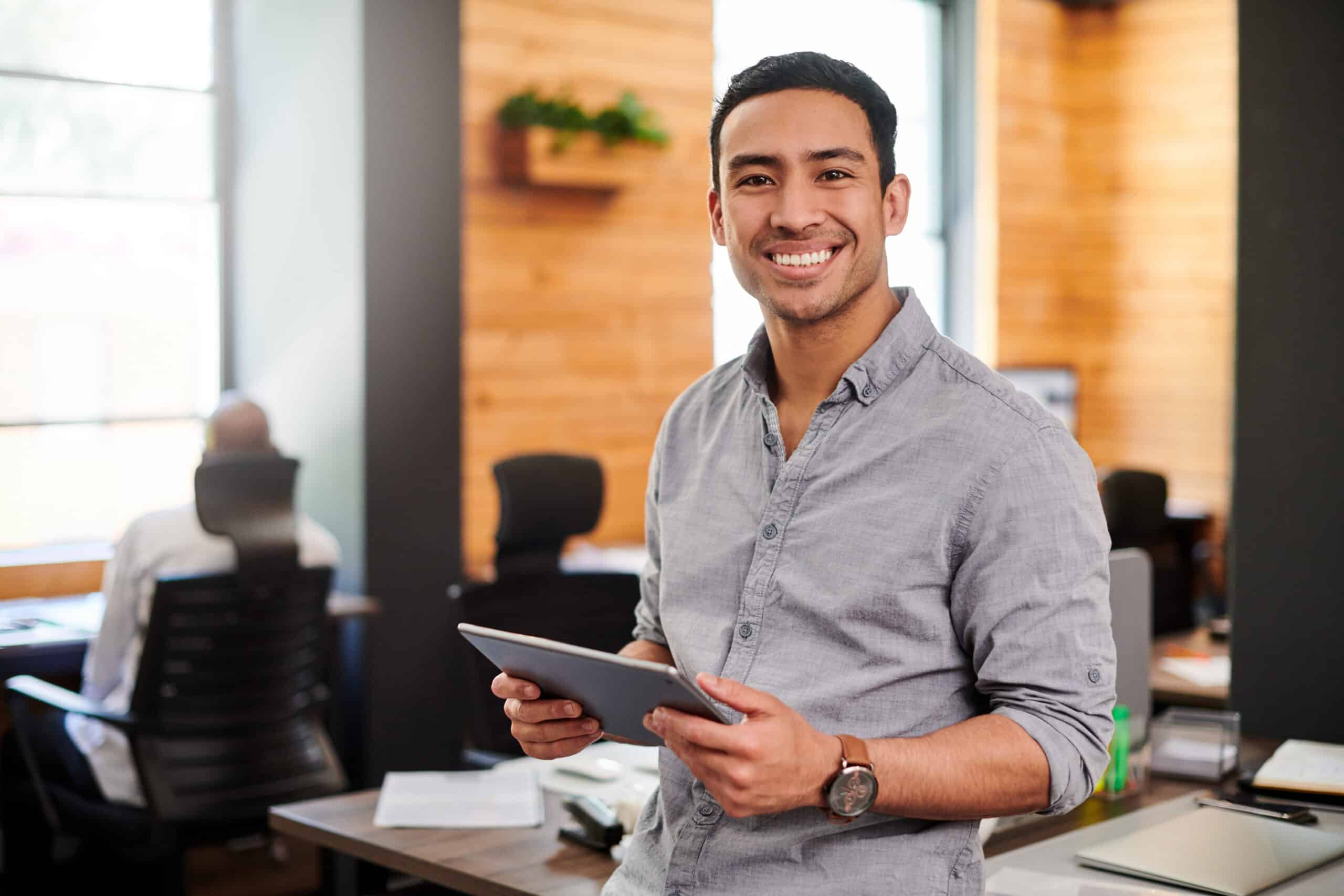 Young businessman using a digital tablet in a modern office