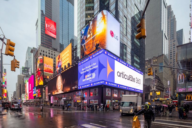 An LED billboard in Times Square announces Articulate as the G2 2026 #1 winner, Best Enterprise Software