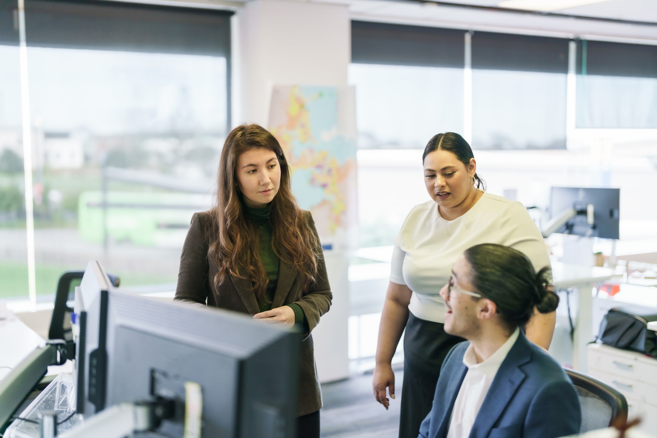 Colleagues having a discussion in an office setting