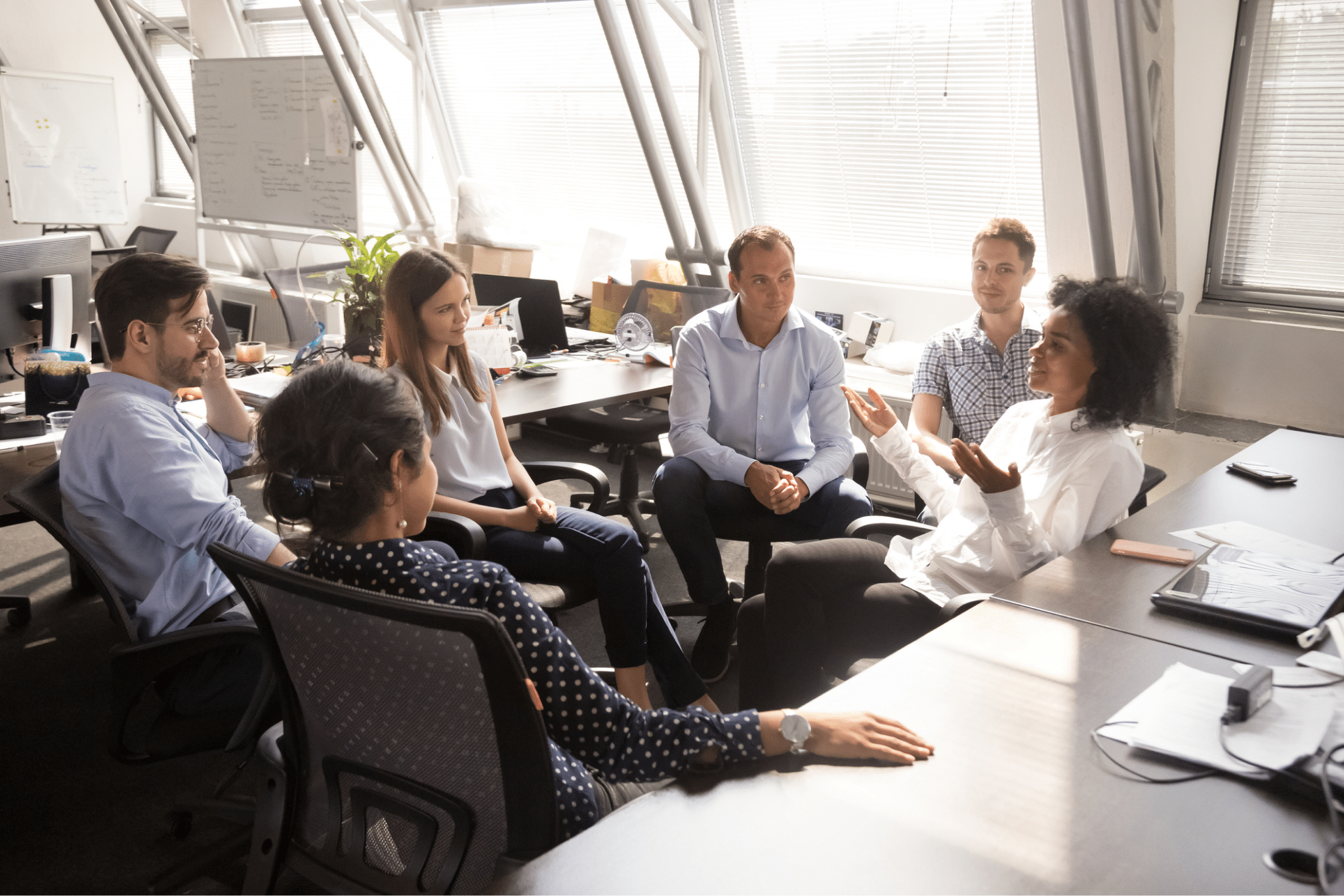 Coworkers having a meeting in an office setting