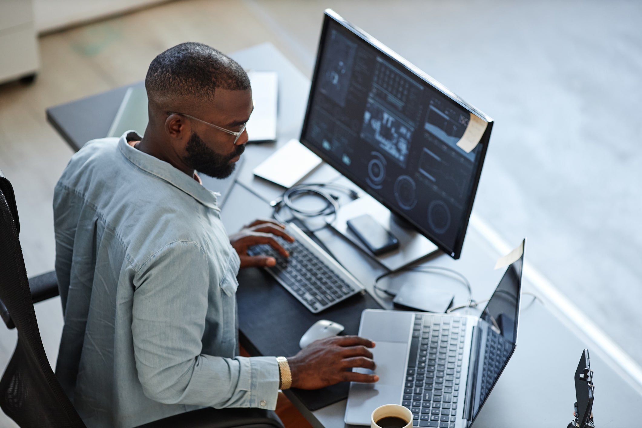 Man sitting at desk working on computer