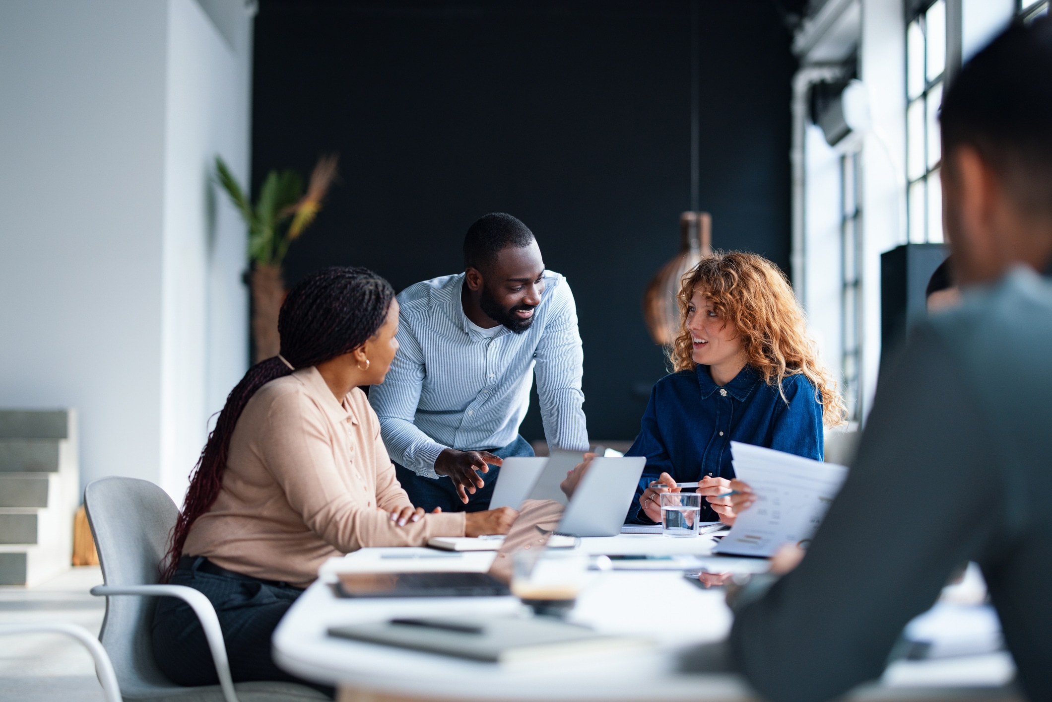 A group of colleagues working together in a contemporary office environment